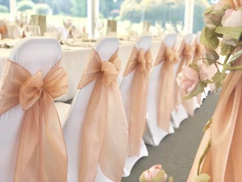 Magical Touch Venue Styling in Essex - Wedding Chair Covers | hitched.co.uk Tulle Chair Decorations, Wedding Chair Cover Ideas, Chair Bows Wedding, Pink Chair Covers, Wedding Chair Decor, Wedding Chair Cover, Wedding Columns, Wedding Chair Covers, Wedding Ceremony Chairs