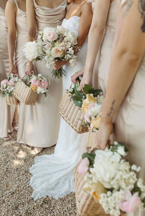 Wooden parasols, wicker baskets, and champagne hues ... This Charlottesville vineyard wedding feels like a picture-perfect summer picnic in a French palace garden. And the story is as romantic as the setting. Wedding Bouquet Basket, Floral Baskets Wedding, Bridesmaid Flower Basket, Basket Flowers Bridesmaids, Bridesmaids Floral Baskets, Bridesmaid Floral Basket, Wedding Parasols Ceremony, Wedding Parasols Bridesmaids, Wicker Basket Wedding Decor