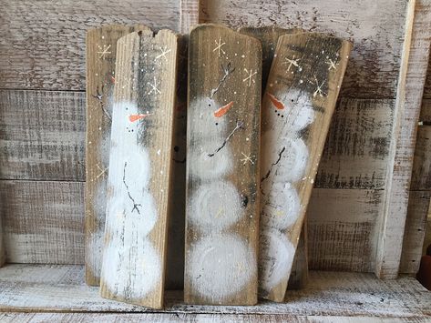 "Listing is for one snowman painting. Choose the one you would like, A, B, C, D, E or F from the last 3 photos (if it is still available). (I will combine shipping and refund any overage if you need more than one) These adorable snowmen are completely hand painted freehand on recycled wood. The wood was once a fence that I saved from going to the landfill. I maintained as much of the woods imperfections as I could, only sanding the wood enough to be able to paint on it. Some of the pieces have h Rustic Wood Snowman, Christmas Art On Wood, Decorating With Skis, Pallet Wood Christmas Decor, Painted Snowmen On Wood, Hand Painted Snowman, Old Fence Board Projects, Wood Snowman Crafts, Wood Board Painting Ideas