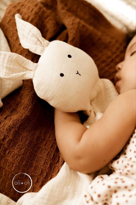 These soft, huggable blankets are designed to provide a sense of familiarity and comfort to children, helping them feel safe and secure as they drift off to sleep. The small size of the mini cuddle bunny makes it easy for children to carry with them wherever they go, providing a constant source of comfort and reassurance. For many parents, these blankets are an essential part of their child's bedtime routine, helping to create a calm and peaceful environment for a good night's sleep. Kids Bedtime Routine, Mini Bunny, Bunny Lovey, Bunny Blanket, Nursery Style, Cuddle Blanket, Entertaining Gifts, Handmade Baby Gifts, Bunny Designs