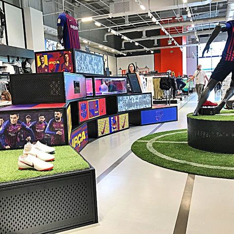 Image showing the interior of Nike's Barcelona flagship store. Roller Boogie, Retail Display Shelves, Nike Retail, Raleigh Bikes, Qatar Football, Illuminated Signage, Retail Trends, Soccer Store, Reading Projects