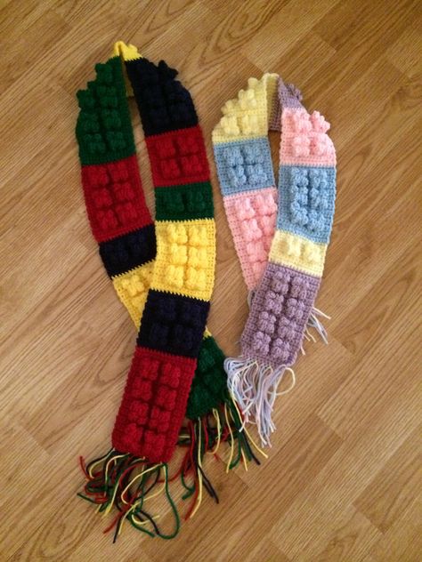 Crochet Lego Scarf Single Crochet – SC Double Crochet- DS Red yarn – R Blue yarn – B Yellow yarn – Y Green yarn – G R- will be an 8 Lego block 16 chain stitch 3 rows of SC, 2 rows of – 4 SC, Popcorn stitch using the DS 2 times, 4 SC, Popcorn stitch using the DS 2 times, 4 SC  4 rows of SC – repeat 3 more times B – Will be a 4 Lego block Y– Will be a 6 Lego Block G– will be a 2 Lego block R–make 4 Lego block B– make 6 Lego block Y- make the 2 Lego  block G– make the 8 Lego  block Lego Scarf, Crochet Lego, Yellow Yarn, Green Yarn, Popcorn Stitch, Lego Blocks, Stocking Cap, Crochet Girls, Red Yarn