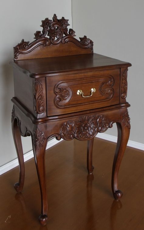 Intricately hand carved French Rococo Bedside with pediment. Hand crafted from solid mahogany and finished with a wax polish to  enhance the colour of the wood. Available from Lock Stock and Barrel Furniture. Hand Carved Wood Furniture, Rococo Bedside Table, Polish Furniture, Victorian Style Furniture, Hand Carved Furniture, Rococo Furniture, Wood Carving Furniture, Vintage Bedside Table, Brass Swan