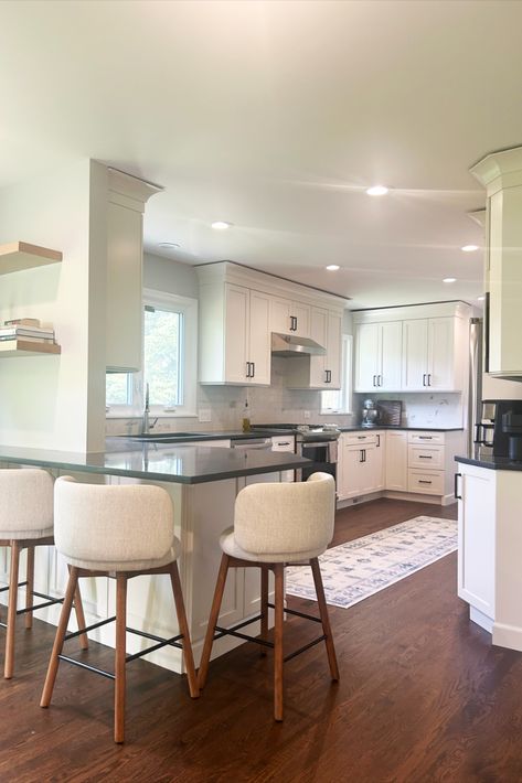 White kitchen with a peninsula that wraps around a wall with seating, white chairs Wrap Around Peninsula Kitchen, Galley Kitchen Peninsula, Kitchen Peninsula Design, Peninsula Kitchen Design, Peninsula Kitchen, Kitchen Peninsula, Study Corner, Galley Kitchen, Kitchen Projects