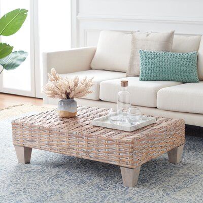 Create an instant indoor oasis with this Esin coffee table. Traditionally styled colonial legs are the perfect foundation for Esin's natural banana rattan, making it a new coastal-chic icon. Color: Natural White Wash | Breakwater Bay Esin Wicker Coffee Table Wood in White | 12 H x 39.6 W x 26.8 D in | Wayfair Coastal Coffee Table, Indoor Oasis, Wicker Coffee Table, Spindle Dining Chair, Cane Dining Chair, Vanguard Furniture, Bench Designs, Coffee Table White, Coffee Table Wayfair