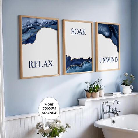 Transform your space with our Blue and Gold Bathroom Decor set! This charming trio of prints features elegant designs with uplifting messages: "Relax, Soak, Unwind." Perfect for adding a touch of serenity to your bathroom, these vibrant blue and gold pieces create a calming atmosphere. Elevate your oasis today! Unframed prints are available in the following sizes below: ----------------------------------------------------------------------------- 8x10in -  prints are shipped in a board-backed en Blue And Gold Bathroom Decor Ideas, Blue White And Gold Bathroom, Blue And Gold Bathroom Decor, Blue Bathroom Ideas Decoration, Navy Blue And Gold Bathroom, Blue Bathroom Decor Ideas, Blue Bathroom Art, Blue And Gold Bathroom, Navy Blue Bathroom