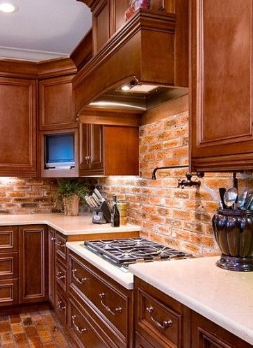 Pot-Filler is a must-have in a Cook's Kitchen.  The dark metal looks great with the brick. Brick Kitchen Ideas, Red Brick Kitchen, Brick Kitchen Backsplash, Cooks Kitchen, Backsplash With Dark Cabinets, Brick Backsplash Kitchen, Kabinet Dapur, Brick Kitchen, Brick Backsplash