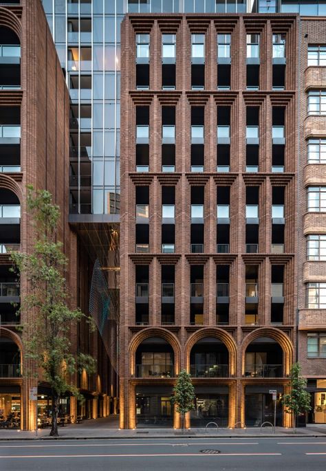 Brick arches are topped by glass tower at Arc by Koichi Takada Architects