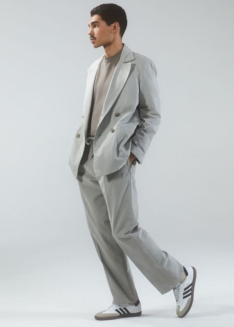 Jacket, $900, and pants, $325, by Stoffa. Sweater, $1,075, by Boglioli. Sneakers, $90, by Adidas. Socks, $37, by Pantherella. Suit Sneakers Men, Relaxed Suit Men, Suit With Tshirt, Suit And Sneakers Men Outfits, Suit With Sneakers Mens, Light Grey Blazer Outfit Men, Oversized Suits Men, Suite Men, Suit Outfit Men