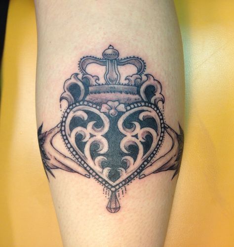 Claddagh by Blue Fin Tattoos Tatoo Crown, Lucky Charm Tattoo, Irish Claddagh Tattoo, Claddagh Tattoo, Chandelier Tattoo, Key Tattoo Designs, Tattoo Writing, Tattoo With Flowers, Claddagh Symbol