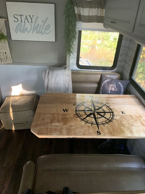 I cut down the sheet of wood into planks, attached them to the base with wood glue and trim nails - applied the decal then polyurethaned - and you have yourself a custom booth table.  #motorhomebooth #motorhometable Small Travel Trailer Remodel, Tent Trailer Remodel, Camper Table, Small Travel Trailer, Popup Camper Remodel, Camper Redo, Rv Interior Remodel, Small Camper, Camper Trailer Remodel