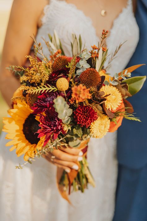 Autumn wedding at a Rustic Montana venue during golden hour! Fall Bouquet Wedding Sunflowers, Terracotta Wildflower Bouquet, Fall Bouquet Sunflower, Autumn Bridal Flowers, Fall Wedding Flowers Sunflowers, Whimsical Fall Bouquet, Fall Wedding Ideas October Centerpieces, August Bouquet Wedding, Sunflower Bridal Bouquet Rustic