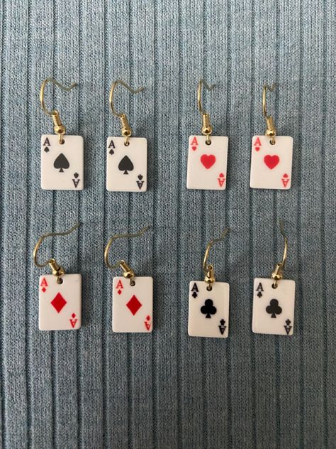 Ace playing card earrings on gold earring hooks Playing Cards Earrings, Craft Earrings Ideas, Hazbin Hotel Earrings, Funky Earrings Vintage, Ace Earrings, Ace Playing Card, Playing Card Crafts, Ace Of Clubs, Card Costume