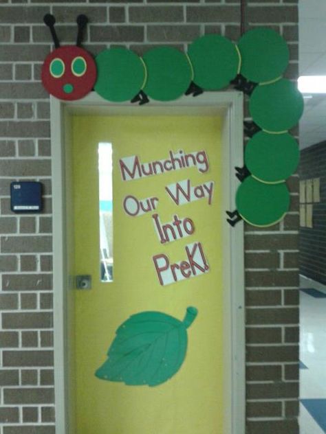 My classroom door decorated for the year. Hungry Caterpillar Classroom Door, Book Entrance, Eric Carle Classroom Decor, Eric Carle Classroom Theme, Hungry Caterpillar Classroom, Eric Carle Classroom, Spring Classroom Door, Classroom Door Decorating, Classroom Door Decorations