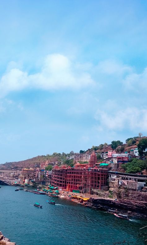 Omkareshwar is a Hindu temple dedicated to Shiva, located in Mandhata, nearby Khandwa city in Khandwa district of the Indian state of Madhya Pradesh. It is one of the 12 revered Jyotirlinga shrines of Shiva. It is on an island called Mandhata, near Khandwa city in the Narmada River at Khandwa district in Madhya Pradesh, India; the shape of the island is said to be like the Devanagari ॐ symbol. ॐ Symbol, Nail References, Mahakal Pic, Mahakal Pic Ujjain, Narmada River, Hindu Temple, Cute Couple Poses, Madhya Pradesh, Couple Poses