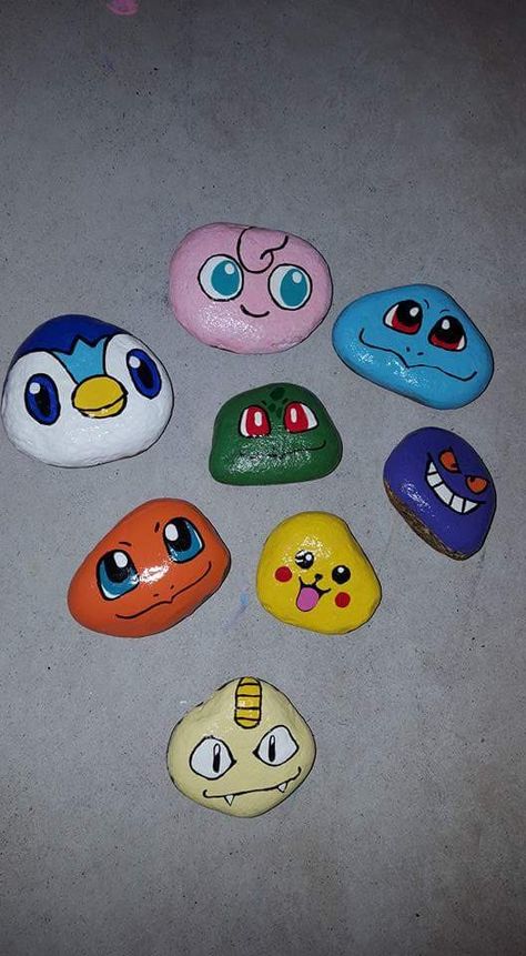 Different Pokemon faces free hand painted rocks Rock Painting Pokemon, Pokemon Rocks Painting, Pokemon Painted Rocks, Painting Ideas Pokemon, Pokemon Face Paint, Pokemon Stones, Pokémon Painting, Painting Rocks Ideas, Stone Painting Ideas