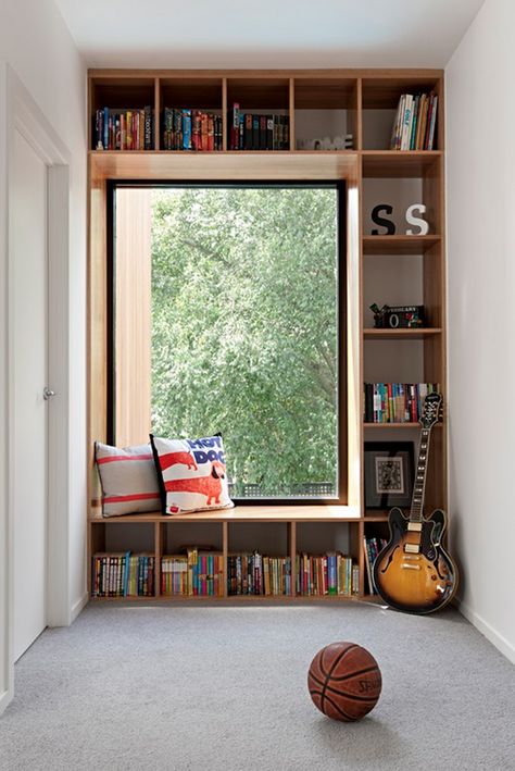 Maximize the space under your windows by building a custom wooden window seat with built-in storage. This project combines comfort with practicality, providing a cozy spot to sit and read while offering extra storage for blankets, books, or toys. The seat can be topped with cushions for added comfort. Wooden Window Seat, Bookshelf Window Seat, Mid Modern House, Cozy Window Nook, Window Seat Ideas, Window Seat Design, Bungalow Renovation, Small Home Offices, House Extension Design