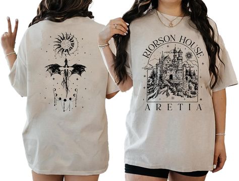 PRICES MAY VARY. AWESOME SHIRT: Dive into the mythical world of Aretia with this captivating T-shirt, featuring intricate designs inspired by the legendary riders and their formidable dragons. This Xaden Riorson House Aretia shirt is perfect for fans of fantasy adventures and dragon lore. DETAILS: 100% cotton. Antique colors & Sport Grey: 90/10 cotton/polyester. Ash Grey: 99/1 cotton/polyester. Medium fabric (5.3 oz/yd² (180 g/m²)) Product color may vary slightly due to photographic lighting sou Book Clothes, Holiday Humor, Ash Grey, Cool Shirts, Heather Grey, Looks Great, Colorful Shirts, Shirt Designs, Relaxed Fit