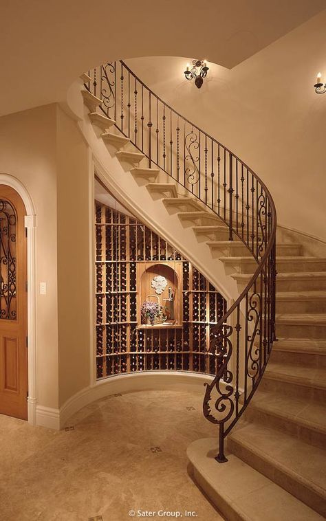 The curved main staircase shelters the wine cellar below. سلالم حلزونية, Luxury Staircase, Circular Stairs, Traditional Staircase, Stairs Design Interior, Home Wine Cellars, Stairway Design, Stairs Design Modern, Staircase Decor