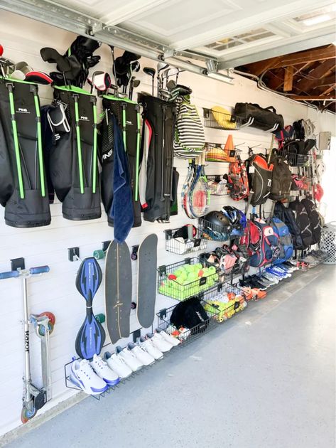 As a professional organizer, finding systems to organize garages is my absolute favorite! Tap to shop my garage organization must-haves Garage Organization Ideas Sports Equipment, Garden Garage Storage, Garage Baseball Organization, Gear Garage Organization, Hang Stroller In Garage, Baseball Organization Ideas Garage, Baseball Bag Storage Garage, Diy Garage Sports Storage, Sport Storage Garage