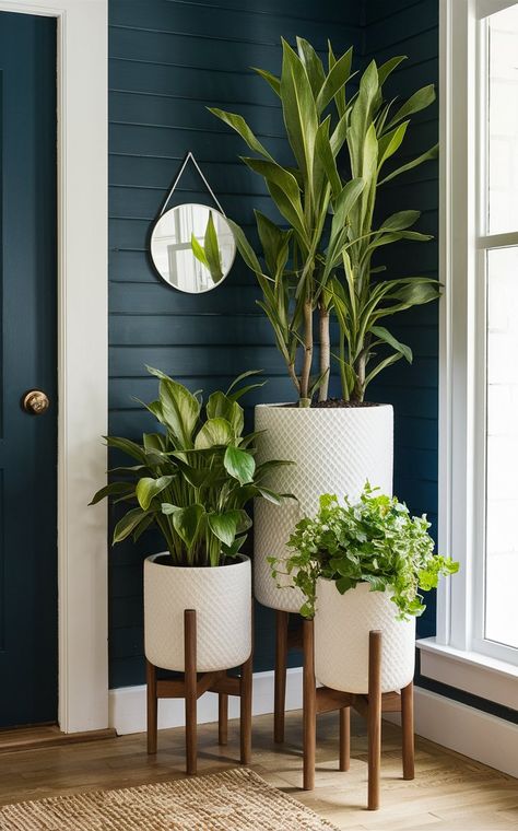 Upgrade your modern patio with our innovative tall outdoor planter ideas. Explore contemporary designs that complement any modern outdoor setting. Plant Setting Ideas, Modern Living Room With Plants, Office Plants Ideas, Planters Ideas Indoor, Indoor Planter Ideas, Home Plants Indoor, Planter Stand Indoor, Inside Plants Decor, Living Room Plants Decor