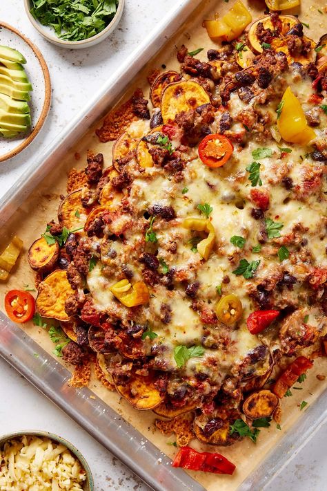 Sheet pan filled with layers of sweet potato chili nachos with pickled peppers, cilantro, and cheese sprinkled on top. Sweet Potatoes Nachos, Sheet Pan Mexican, Sweet Potato Sheet Pan, Roasted Sweet Potato Slices, Potato Sheet Pan, Chili Nachos, Sheet Pan Nachos, Pan Nachos, Potato Nachos