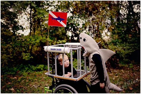 Dustyn decided he wanted to be a shark for this Halloween, so I just knew we needed to make Carsyn a Shark Diver Wheelchair Costume. Shark & Shark Diver Wheelchair Costume The cage is made out ... Diver Costume, Shark Baby Costume, Wheelchair Costumes, Scooby Doo Costumes, Incredibles Costume, Jack Sparrow Costume, Ghostbusters Costume, Shark Costume, Robot Costumes