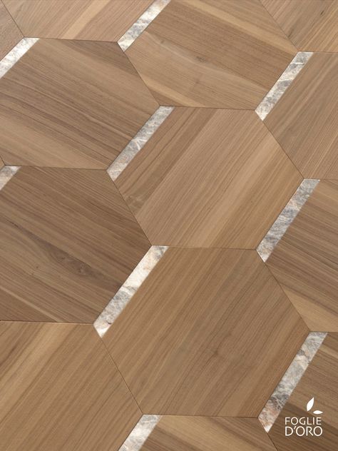 Alveo modular floor by @fogliedoro - Elementa Collection, design by Marco Piva - celebrates the beauty of natural structures, with the repetition of hexagonal elements. Americal Walnut wood and marble inserts, in a sophisticated composition. Alveo | Installation 343 #fogliedoro #woodfloors #woodflooring #woodmodularpanel #wooddesignpanel #luxuryfloors #luxuryflooring #designpanels #designparquet #italiandesign #modularfloor #madeinitaly #craftsmanship #italianfloors #solidwoodfloors Hexagon Wood Flooring, Timber Floor Pattern, Wooden Flooring With Brass Inlay, Floor Parquet Texture, Royal Atlantis, Materials Texture, Hexagonal Tiles Texture, Interior Textures, Natural Stone Texture