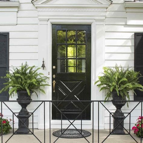 Better Homes & Gardens on Instagram: “We’re seeing more and more homeowners going for a black front door! It’s true what they say: black goes with everything. Any time you want…” Iron Railings Outdoor, Porch Railing Designs, Front Porch Railings, Black Front Doors, Railings Outdoor, Flagstone Patio, Porch Railing, Garden Makeover, Iron Railing