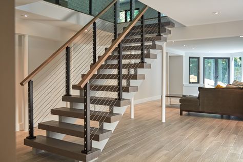 This urban home in New York achieves an open feel with several flights of floating stairs accompanied by cable railing with Aluminum posts. Cable Stair Railing, Banister Remodel, Style Californien, Stainless Steel Cable Railing, Wood Handrail, Handrail Design, Staircase Remodel, Stair Remodel, Stairs Design Modern