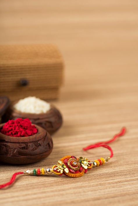 Indian festival: Raksha bandhan with an elegant rakhi, rice grains and kumkum. A traditional indian wrist band which is a symbol of love between brothers and sisters. Download it at freepik.com! #Freepik #photo #gift #celebration #event #rice Rakhi Pics, Blessings Always Guruji Wallpaper, Raksha Bandhan Pics, Rakhi Images, Rakhi Wishes, Happy Raksha Bandhan Images, Raksha Bandhan Images, Happy Birthday Sis, Rakhi Festival