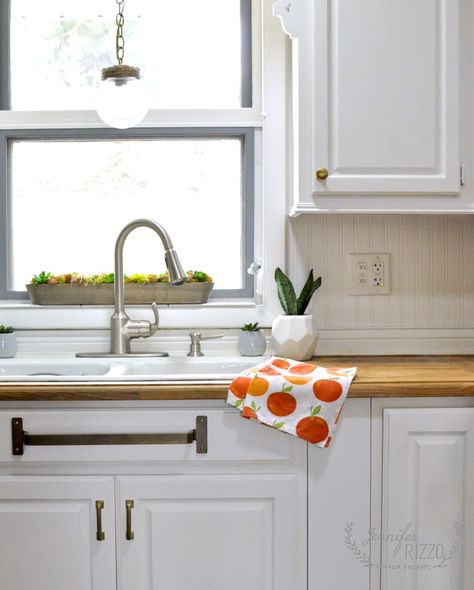 Mini-kitchen makeover with gray painted window trim and a brass towel bar under the sink, on the faux drawer to dry and hang dish towels. Painted Window Trim, Kitchen Countertop Organization Ideas, Brass Towel Bar, Kitchen Countertop Organization, Organizer Ideas, Countertop Organization, Countertop Organizer, Mini Makeover, Low Cabinet