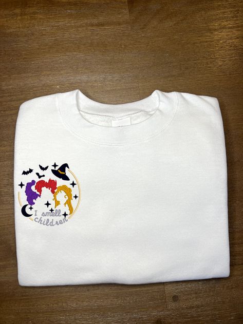 This custom embroidered sweatshirt Hocus Pocus Sweatshirt is perfect for all Halloween lovers - for anytime of the year! All clothing from Alora Astrid are handmade-to-order, just for you! Hocus Pocus Sweatshirt, I Smell Children, Custom Embroidered Sweatshirt, Halloween Lovers, Sanderson Sisters, Embroidered Sweatshirt, Hocus Pocus, Embroidered Sweatshirts, The Year