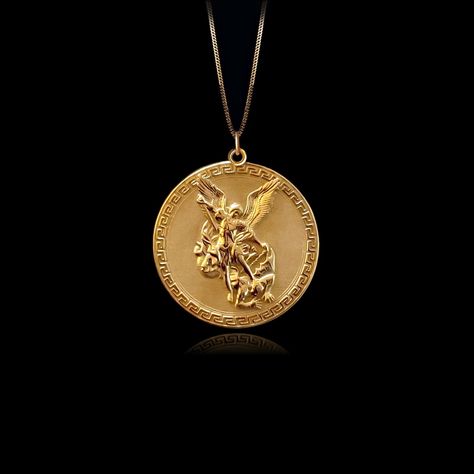 Embrace divine protection with the Gold St. Michael Pendant. Crafted in radiant Gold, this pendant features St. Michael, the archangel known for his role as a protector and warrior. The intricate design highlights his iconic image, making it a powerful accessory for those seeking a symbol of strength and guidance. PENDANT INFORMATIONThis pendant is made of real, solid gold.• Made in USA• Material: 14k or 18k solid gold• Finish: polished• Height: 1.13" (29 mm) x Width: 1" (26 mm)• Pendant weight: Spiritual Yellow Gold Coin Necklace With Large Pendant, Yellow Gold Necklaces With Coin Pendant For Blessing, Men’s Gold Necklace, Christian Spirituality, St Michael Necklace, St Michael Pendant, Divine Protection, Michael The Archangel, Gold Pendants