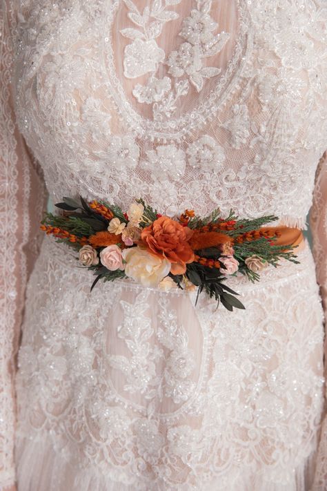 Handmade flower belt made from artificial flowers and preserved materials in woodland design in terracotta tones... #wedding #weddinginspiration #bridetobe #weddingday #weddingdesigner #uniquebride #bohowedding #flowers #flowershop #bridaldress #flowerbelt #floralbelt #beltforbridaldress #handmadedesign #terraccotta #terraccotawedding Wedding Dress Autumn, Belt For Wedding Dress, Terracotta Flowers, Floral Belt, Flower Belt, Autumn Bride, Wedding Dress Belt, Desert Flowers, Unique Bride