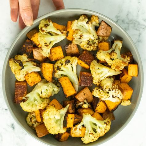 Garlicky Roasted Cauliflower and Sweet Potato comes together all on one sheet pan for an easy, crowd-pleasing side dish. These veggies pack a serious flavor punch! #roastedvegetables #oven #healthy #easy #sheetpan #cauliflower #sweetpotato Cauliflower Sweet Potato, Curried Couscous, Easy Roasted Cauliflower, Couscous Salad Recipes, Sweet Potato Tacos, Riced Cauliflower, Cubed Sweet Potatoes, Vegan Sweet Potato, Salad With Sweet Potato