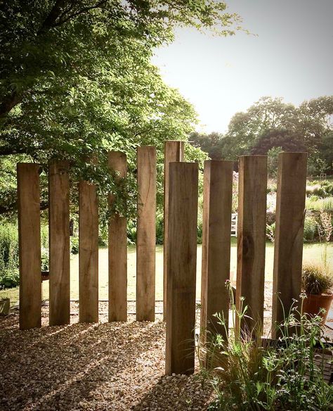 PROJECTS — GUY WOODHOUSE GARDENS LTD Wooden Garden Screening Ideas, Sleeper Fence, Natural Fencing, Garden Screening Ideas, Oak Fence, Privacy Screen Garden, Sleepers In Garden, Garden Dividers, Oak Sleepers