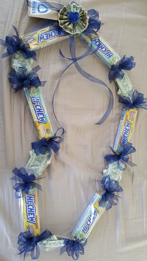 I used a HI-Chew candy bar that is exclusive in Hawaii..Lilikoi HI-Chew...you can find it at ABC stores in Waikiki...I also used the origami ALOHA shirts dollar bills...I used a $20 for the finishing bow Hi Chew Candy Lei, Graduation Necklace Ideas Candy, Food Leis For Graduation, Graduation Candy Lei, Grad Leis, Soccer Senior Night, Graduation Leis Diy, Candy Lei, Senior Crowns