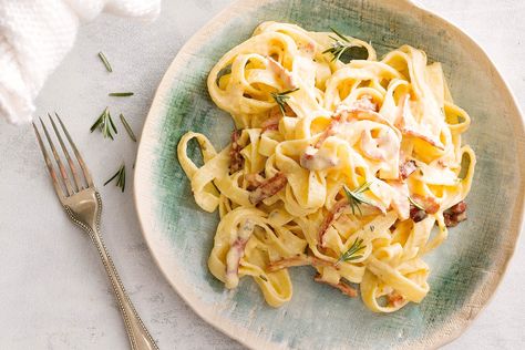 I can see the purists out there raising their fists. Yes, I know, I know - carbonara recipes don’t traditionally have cream in them! But depending on my mood I sometimes like to add it. When I’m calm and focussed, I go the authentic route; where hot pasta is added to a mixture of egg and finely grated parmesan and gently tossed off the heat until a silky sauce forms, lightly covering the pasta strands. It’s not necessarily difficult, you just have to ensure the eggs aren’t over or under cooked.
Some nights when craving the umami bomb that is carbonara without the guesswork I turn to this recipe. It’s perfect! The clever addition of cream stabilises the egg mixture, giving you the authentic taste with a safety net!
Seeking further carbonara inspiration? Try this spaghetti carbonara next. Carbonara Recipe Creamy, Fettuccine Carbonara, Tagliatelle Recipe, Resep Pasta, Carbonara Sauce, Fettuccine Pasta, Hello Fresh Recipes, Carbonara Recipe, Pasta Gnocchi