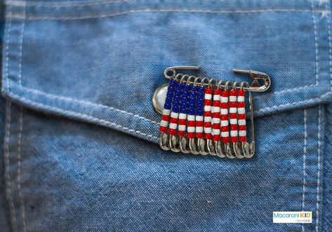 This beaded American flag pin is an easy craft project for all skill levels. All you need to make this beaded American flag pin are some safety pins and beads! Beaded American Flag Pin What you need: Beads (red, white/clear, and blue) Safety pins (medium to large) Instructions: You may need more or fewer beads, depending on the sizes of your beads and safety pins. For the pin pictured, we counted out 25 small blue beads, 35 red beads, and 30 clear/white beads. Count out 11 safety pins... Crafts For Camp, Milk Carton Crafts, Safety Pin Crafts, American Flag Pin, Flag Beads, Blue Crafts, 4th Of July Ideas, Flag Pins, July Ideas