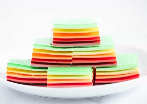 Rainbow Jello is an impressive dessert that’s fun to eat and loved by the whole family. Three simple ingredients are all you’ll need to create this fun and colorful dish. It’s sure to be a hit at your next party! Layered Jello Dessert, Rainbow Jello Recipe, Layered Jello Recipe, Finger Jello, Rainbow Jello, Jello Recipe, Jello Dessert, Impressive Dessert, Layered Jello