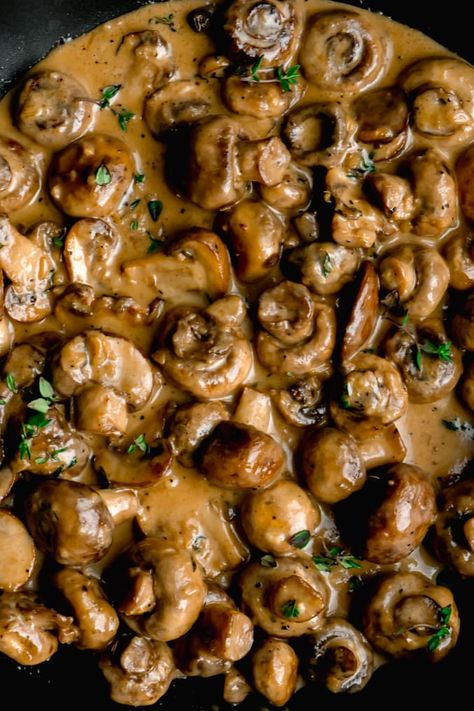 Cremini and button mushrooms sauteed in butter and garlic. Then quickly simmered in a creamy parmesan sauce until tender. The perfect topping to pork or steak off the barbecue or just eat'em all by themselves! #creamygarlicmushrooms #garlicmushrooms #sauteedgarlicmushrooms #garlicmushroomsrecipes #mushroomrecipes #garlicmushroomsauce # Sauteed Button Mushrooms, Mushroom Topper For Steak, Steak Toppers, Cremini Mushroom Recipes, Creamy Mushroom Steak, Thanksgiving Mushrooms, Mushroom Side Dish Recipes, Keto Prep, Mushrooms Sauteed