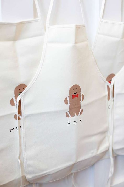 Gingerbread aprons at a woodland Christmas birthday party! See more party planning ideas at CatchMyParty.com! Christmas Tea Party Birthday, Gingerbread Man Party Decorations, Gingerbread Man Theme Party, Christmas Themed Kids Birthday Party, Christmas Birthday Activities, Christmas Cookie Birthday Party, Christmas 3rd Birthday Party, Gingerbread Birthday Party Ideas, Gingerbread Theme Birthday Party