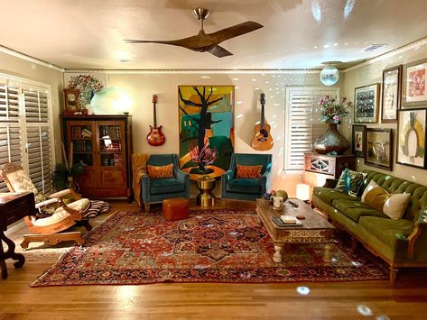 A picture of someone’s living room inside of their home. It is covered in decorations Hardwood Floor Decor Living Rooms, Retro Apartment Living Room, Indie Living Room, Maximalism Living Room, 90s Living Room, 70s Living Room, Retro Apartment, Vintage Apartment, Retro Living Rooms