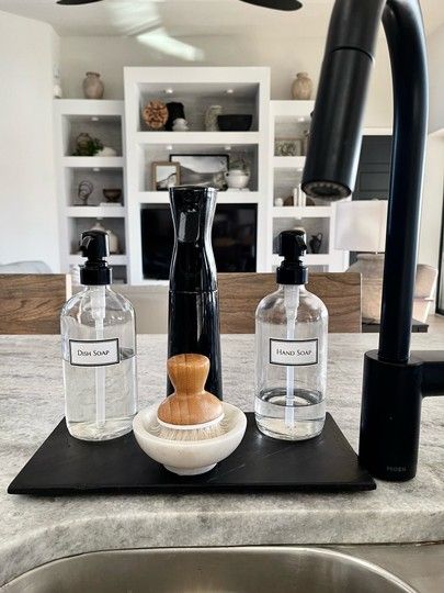 Kitchen Counter Sink Decor, Black And White Aesthetic Kitchen Decor, Black Apartment Aesthetic Kitchen, Kitchen Island Sink Decor, Island With Sink Decor Ideas, Island Sink Decor, Black Aesthetic Kitchen, Kitchen Dish Soap Display, Kitchen Soap Tray Ideas