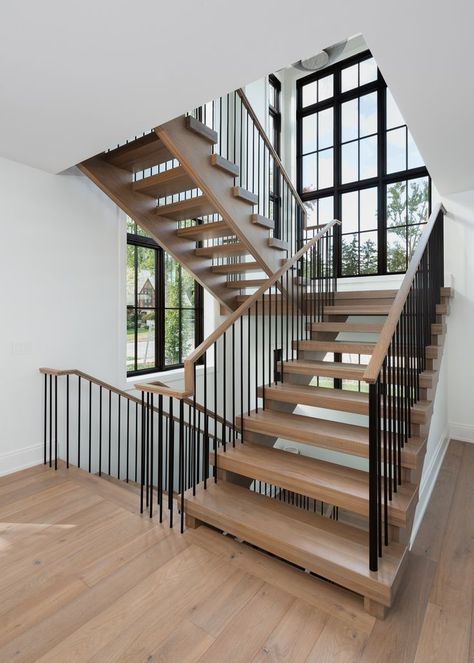 Interior Design: Ellwood Interiors
Architecture: Krieger Klatt Architects
Build: Petrucci Homes
Photographer: @linea.photo Accent Wall Vertical, Steel Accent Wall, Stringer Staircase, Modern Ski Home, Staircase White, Tri Level House, Staircase Architecture, Row House Design, Modern Railing