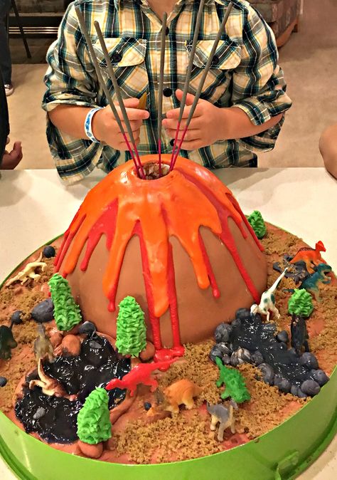 Surprise your dina-loving little one with this awesome exploding volcano dinosaur birthday cake! It's easy to make with just jello and dry ice! Volcano Birthday Party Decorations, Dinosaur Volcano Cake, Fête Jurassic Park, Exploding Volcano, Volcano Birthday, Dinosaur Volcano, Birthday Cake Sparklers, Dinosaur Birthday Cake, Volcano Cake