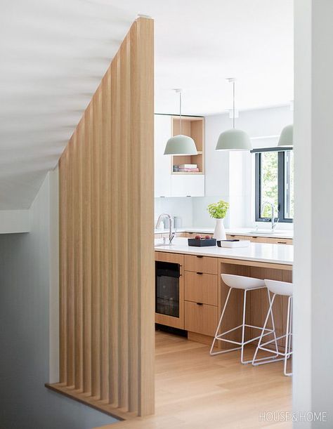 In the kitchen, Stephanie had an eye-catching partial wall of white oak slats installed instead of the usual railing. | Photographer: Phil Crozier | Designer: Stephanie Brown Craftsman Room Divider, White Oak Slat Wall, Wood Slat Room Divider, Slat Room Divider, Timber Screen, House Move, White Marble Floor, Wood Slat Wall, Secret Room