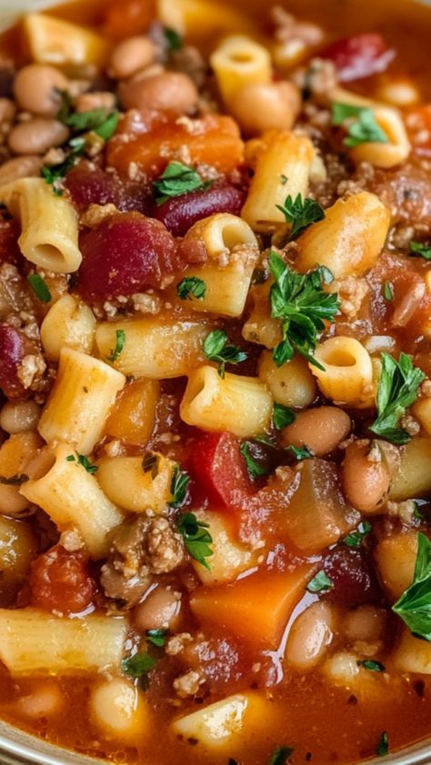 This Copycat Olive Garden Pasta e Fagioli is a comforting, hearty soup full of rich flavors and wholesome ingredients. With a savory combination of ground beef, tender vegetables, beans, and perfectly cooked pasta, this soup is sure to satisfy. It’s easy to make and ideal for a cozy family dinner or meal prep for the week. Best of all, this version captures the essence of Olive Garden’s famous dish while allowing you to enjoy it at home. Pasta Fagioli Soup Olive Garden Instapot, One Pot Soup Easy, Olive Garden Pasta E Fagioli Soup Crockpot, Olive Garden Bean Soup, Olive Garden Slow Cooker Pasta Fagioli, Olive Garden Pasta E Fagioli Soup Recipe, Pasta Y Fagioli Soup, Pasta Fragole Soup, Copycat Pasta Fagioli Olive Garden Soups