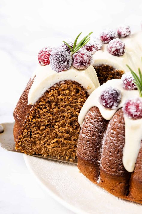 Moist, flavorful Gingerbread Bundt Cake with rich spices and a cream cheese glaze—perfect for the holidays. Spiced Gingerbread Bundt Cake, Bundt Cake Gingerbread, Moist Gingerbread Bundt Cake, Gluten Free Gingerbread Bundt Cake, Xmas Bundt Cake, Bundt Cake Frosting Ideas, Winter Bundt Cake, Frosted Bundt Cake, Christmas Wreath Bundt Cake